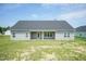 Exterior view of the backyard of the house with a covered patio at 596 Ravensworth Dr, Garner, NC 27529