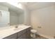 This bathroom has a framed mirror, a sink, a toilet, and a walk-in shower at 596 Ravensworth Dr, Garner, NC 27529