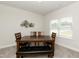 Dining room with a wooden table, a bench, wood chairs, and a decorative wall piece at 596 Ravensworth Dr, Garner, NC 27529