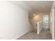 This carpeted hallway leads to the second story of the house at 596 Ravensworth Dr, Garner, NC 27529