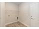 This laundry room has vinyl flooring, a shelf, and hookups for a washer and dryer at 596 Ravensworth Dr, Garner, NC 27529