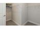 Walk-in closet with built in storage and carpeting at 596 Ravensworth Dr, Garner, NC 27529