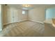 Spacious bedroom with neutral carpeting and double doors at 828 Putney Hill Rd, Zebulon, NC 27597