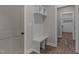 Hallway features a convenient storage bench with hooks, perfect for organizing coats, shoes, and accessories at 125 Leisure Ln, Louisburg, NC 27549