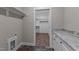 Laundry room with marble countertop and built-in shelving at 125 Leisure Ln, Louisburg, NC 27549