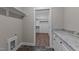 Laundry room features new washer/dryer hookups, granite countertops, and ample storage for household needs at 125 Leisure Ln, Louisburg, NC 27549