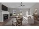 Inviting living room with a brick fireplace, a cozy sofa, and an area rug, creating a relaxing atmosphere at 125 Leisure Ln, Louisburg, NC 27549