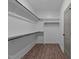 Bright walk-in closet features ample shelving and hanging space, perfect for organization and storage solutions at 125 Leisure Ln, Louisburg, NC 27549