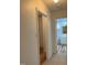 Hallway view leading to a bathroom featuring wood plank flooring at 130 S Estes Dr # G5, Chapel Hill, NC 27514