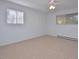 Bright bedroom with a ceiling fan, two windows, and carpet at 130 S Estes Dr # G5, Chapel Hill, NC 27514