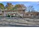 Brick apartment building with a parking lot and manicured landscaping at 130 S Estes Dr # G5, Chapel Hill, NC 27514