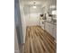 Galley kitchen featuring white appliances and wood plank flooring at 130 S Estes Dr # G5, Chapel Hill, NC 27514