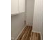 Small utility closet featuring modern flooring, an electrical fixture, and copper plumbing at 130 S Estes Dr # G5, Chapel Hill, NC 27514