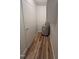 Utility closet featuring modern flooring, a water heater, and built in cabinets at 130 S Estes Dr # G5, Chapel Hill, NC 27514