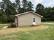 Rear of the property showing the home's siding, landscaping, and access to the spacious backyard at 2253 Nc Highway 96 S, Franklinton, NC 27525