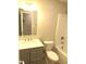 Modern bathroom with gray vanity, white toilet and bathtub at 2253 Nc Highway 96 S, Franklinton, NC 27525