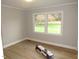 Spacious bedroom with new vinyl flooring and large windows at 2253 Nc Highway 96 S, Franklinton, NC 27525