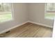 Bright bedroom with new vinyl flooring and large windows at 2253 Nc Highway 96 S, Franklinton, NC 27525