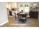 Dining area features modern decor and stainless steel appliances in the kitchen at 2253 Nc Highway 96 S, Franklinton, NC 27525