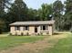 Charming single-story home with a brick facade, dark shutters, and a well-maintained front yard at 2253 Nc Highway 96 S, Franklinton, NC 27525