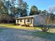 Brick ranch home with mature trees and landscaping at 2253 Nc Highway 96 S, Franklinton, NC 27525