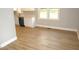 Eat-in kitchen with white cabinets and vinyl flooring at 2253 Nc Highway 96 S, Franklinton, NC 27525