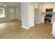 Open-concept room with wood floors that connects the living area to the kitchen at 2253 Nc Highway 96 S, Franklinton, NC 27525