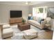 Bright living room with large windows, hardwood floors and modern furniture at 2253 Nc Highway 96 S, Franklinton, NC 27525