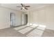 Spacious bedroom featuring a trey ceiling, carpet, and entryways to other rooms at 226 Begen St, Morrisville, NC 27560