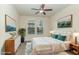 Stylishly decorated bedroom with ceiling fan, a pair of windows and charming furnishings at 226 Begen St, Morrisville, NC 27560