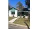 Charming single-story home with green accents and a covered porch, set on a sunny day at 420 E Hinton St, Clayton, NC 27520