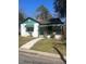 Charming single-story home with green accents and a covered porch, inviting curb appeal at 420 E Hinton St, Clayton, NC 27520