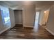 Bright bedroom with a large window and closet featuring durable wood-look flooring at 4553 Dedication Dr, Raleigh, NC 27610