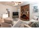 Living room with brick fireplace, sofas, and French doors at 505 Harvard St, Raleigh, NC 27609