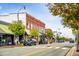 A vibrant street featuring storefronts, pedestrian crosswalks and parked cars showcases community shopping at 105 Windchime Ct, Fuquay Varina, NC 27526