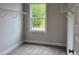 Walk-in closet with natural light from a window provides ample storage space for clothing and accessories at 105 Windchime Ct, Fuquay Varina, NC 27526