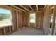 A framed bedroom featuring multiple windows to create a bright interior at 3852 Well Fleet Drive, Willow Springs, NC 27592