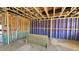 An in-progress view of a framed interior, showcasing the home's construction and infrastructure at 3852 Well Fleet Drive, Willow Springs, NC 27592