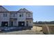 A newly constructed townhome featuring a covered exterior awaiting final finishing at 3852 Well Fleet Drive, Willow Springs, NC 27592