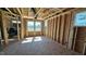 An open-concept living space, showcasing the framing, and windows for natural light at 3852 Well Fleet Drive, Willow Springs, NC 27592