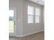Living room with hardwood floors, a bright view and outdoor access door at 3856 Well Fleet Drive, Fuquay Varina, NC 27526