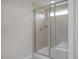 A bright walk-in shower featuring glass enclosure, built-in bench, and tile surround at 3856 Well Fleet Drive, Fuquay Varina, NC 27526