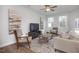 Comfortable living room with modern decor, natural light, and contemporary furnishings for relaxation at 3856 Well Fleet Drive, Fuquay Varina, NC 27526