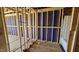 Bathroom under construction, exposing plumbing, partial wall covering and stand-up shower and window at 3858 Well Fleet Drive, Willow Springs, NC 27592