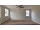 Spacious bedroom features neutral walls, baseboard trim, ceiling fan and multiple windows at 3928 Well Fleet Drive, Fuquay Varina, NC 27526