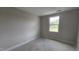 Bedroom features neutral walls, white trim, baseboard trim, and a window at 3928 Well Fleet Drive, Fuquay Varina, NC 27526