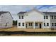 New construction two-story home with white siding and a spacious backyard at 3928 Well Fleet Drive, Fuquay Varina, NC 27526