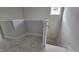 New staircase features neutral walls, white trim, and a wooden railing at 3928 Well Fleet Drive, Fuquay Varina, NC 27526