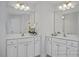 Bright bathroom featuring dual sinks, large mirrors, and ample counter space at 3928 Well Fleet Drive, Fuquay Varina, NC 27526