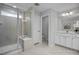 Bathroom featuring a walk-in shower with a built-in seat and dual vanities at 3928 Well Fleet Drive, Fuquay Varina, NC 27526